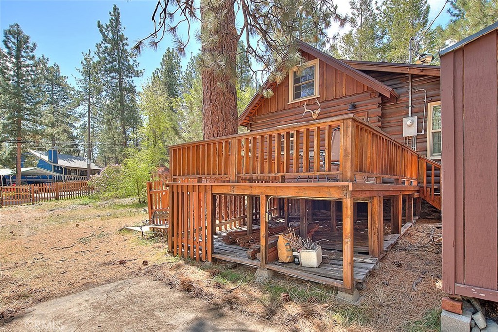5926 Pine Street Wrightwood, CA 92397 - Photo 31 of 66 a view of a house with a yard and wooden fence