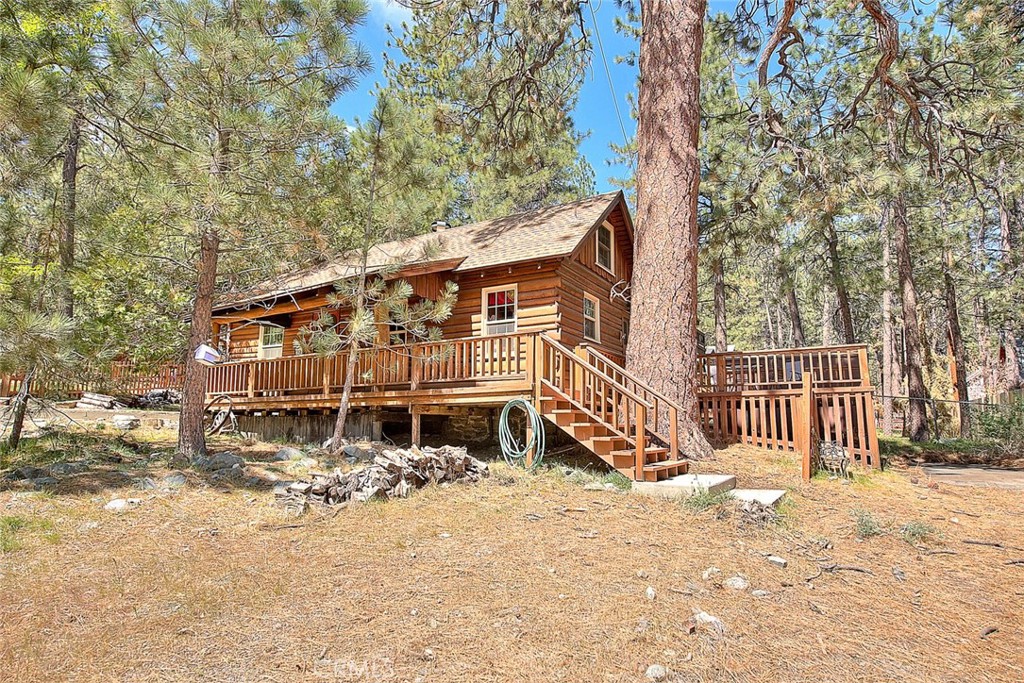 5926 Pine Street Wrightwood, CA 92397 - Photo 49 of 66 a backyard of a house with a tree