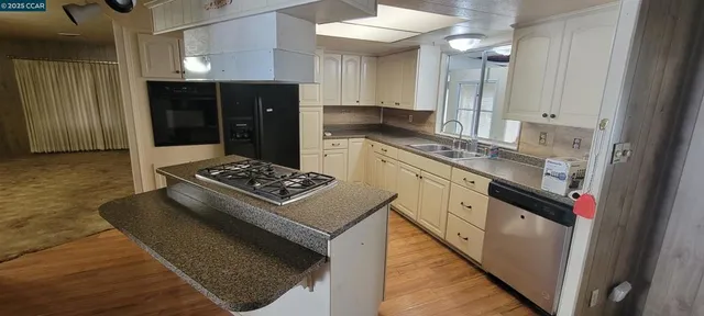 a view of a hallway with couch and closet