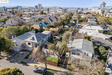 an aerial view of residential houses with outdoor space