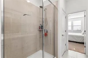 a bathroom with a shower and a tub
