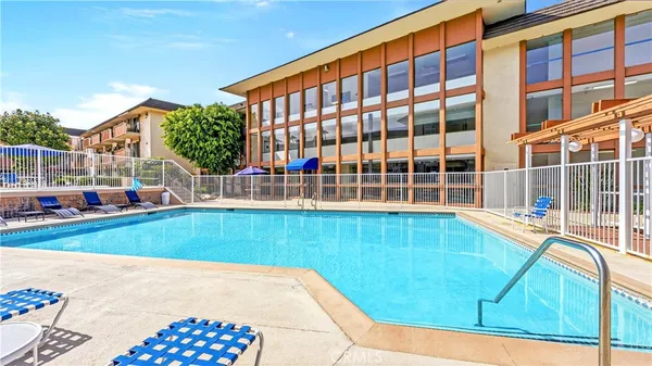 a view of swimming pool with a backyard