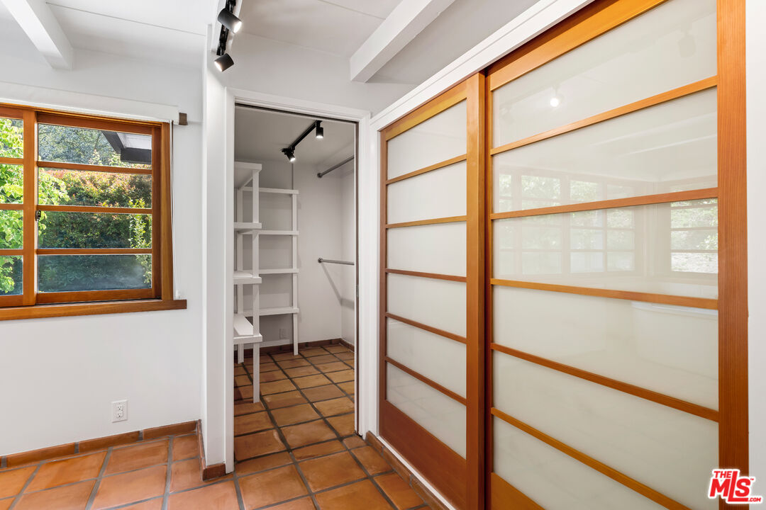 1776 Old Ranch Road Los Angeles, CA 90049 - Photo 11 of 24 a view of a balcony with wooden floor and furniture