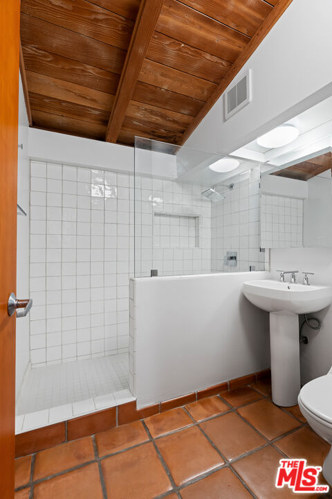 1776 Old Ranch Road Los Angeles, CA 90049 - Photo 13 of 24 a bathroom with a sink a toilet and shower
