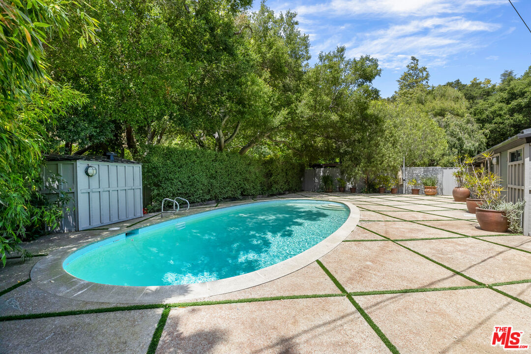 1776 Old Ranch Road Los Angeles, CA 90049 - Photo 20 of 24 a view of a swimming pool with a patio