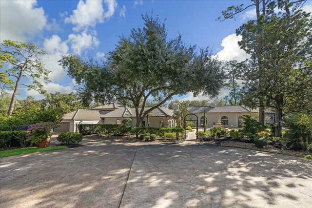 a front view of a house with a street