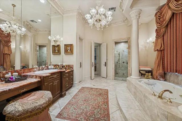 a spacious bathroom with a tub sink and shower