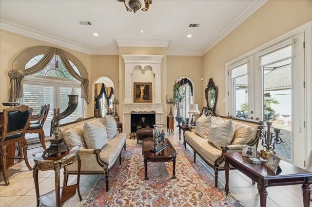 a living room with fireplace furniture and a window