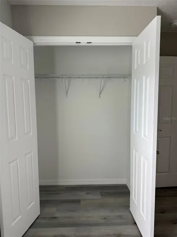 a view of an empty walk in closet