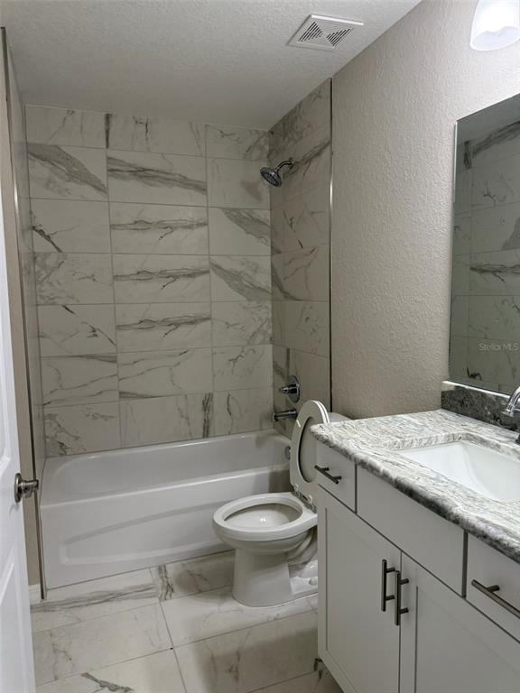 9545 North Travis Drive, Unit A Citrus Springs, FL 34434 - Photo 9 of 15 a bathroom with a sink a toilet and a bathtub