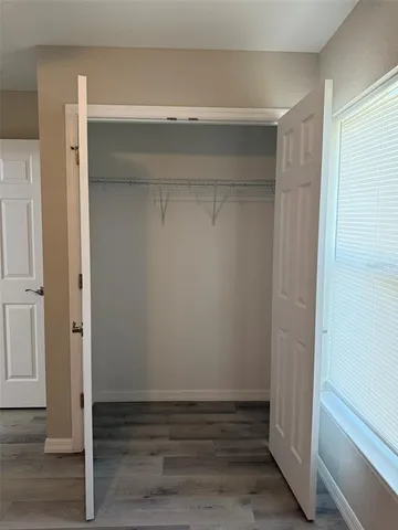 a view of an empty walk in closet