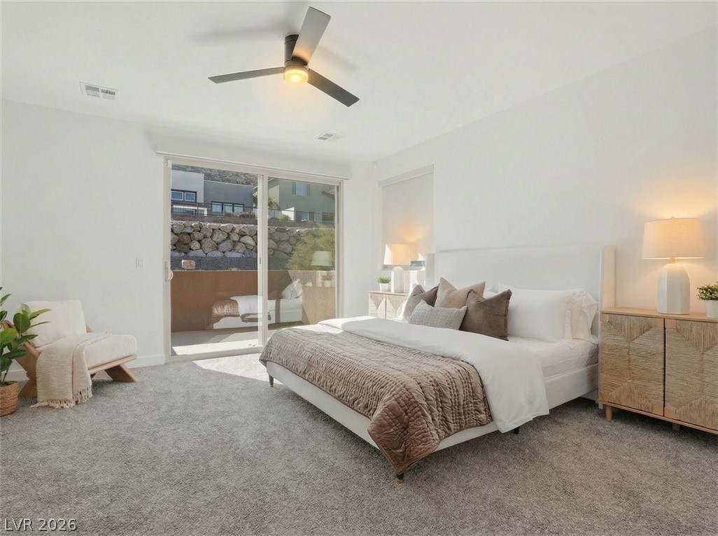 9725 Starlight Ridge Avenue Las Vegas, NV 89148 - Photo 4 of 47 This inviting bedroom provides a tranquil retreat with ample natural light.