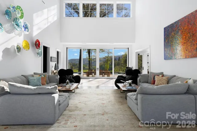 a large white room with mirror and sink
