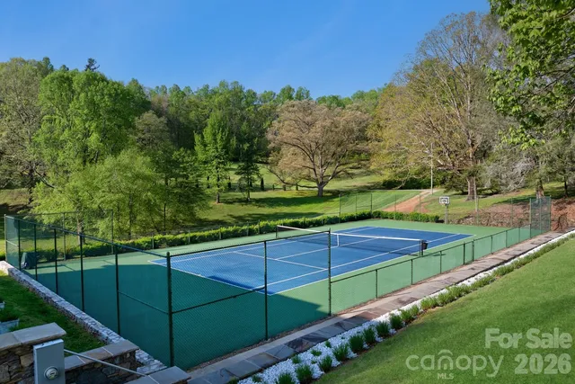 a living room with furniture and a dining table