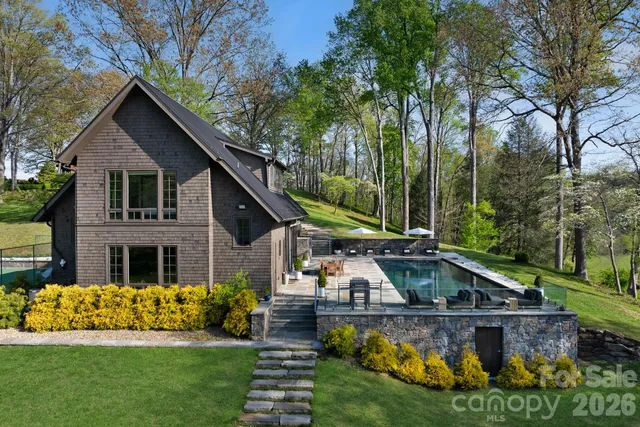 a view of a swimming pool with a lake view