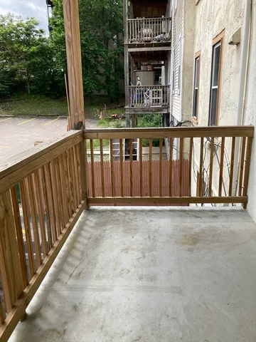 a bathroom with a sink a toilet a mirror and shower