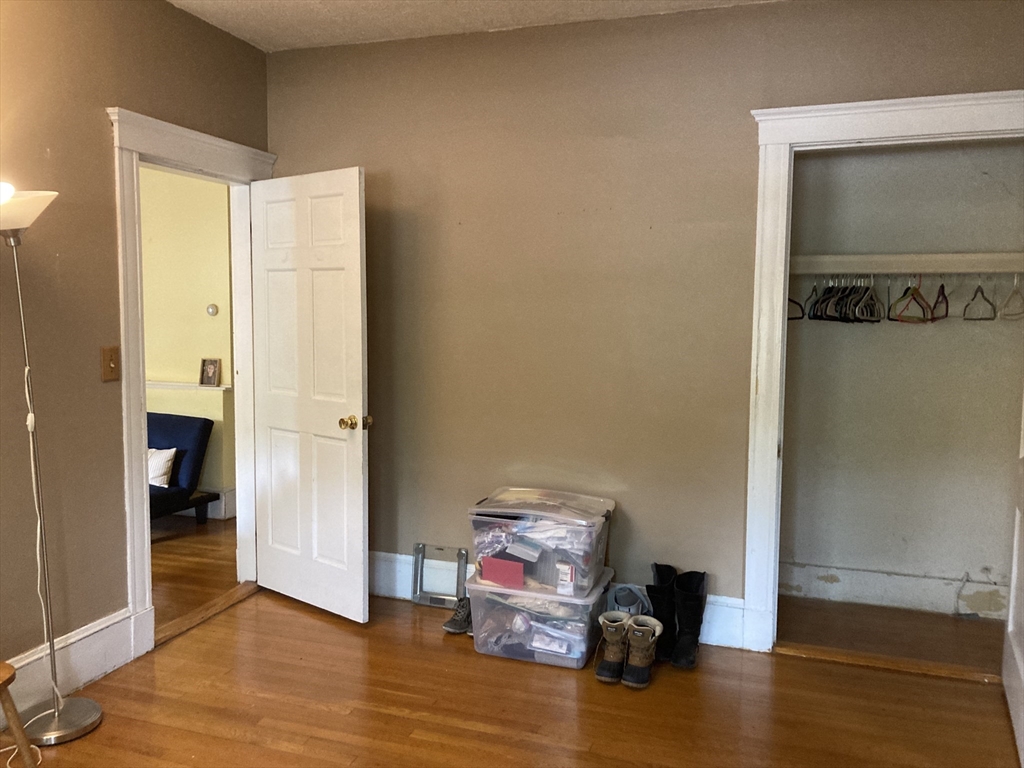 1734 Commonwealth Avenue, Unit 4 Boston, MA 02135 - Photo 5 of 15 a view of a room with wooden floor cabinet and bathroom