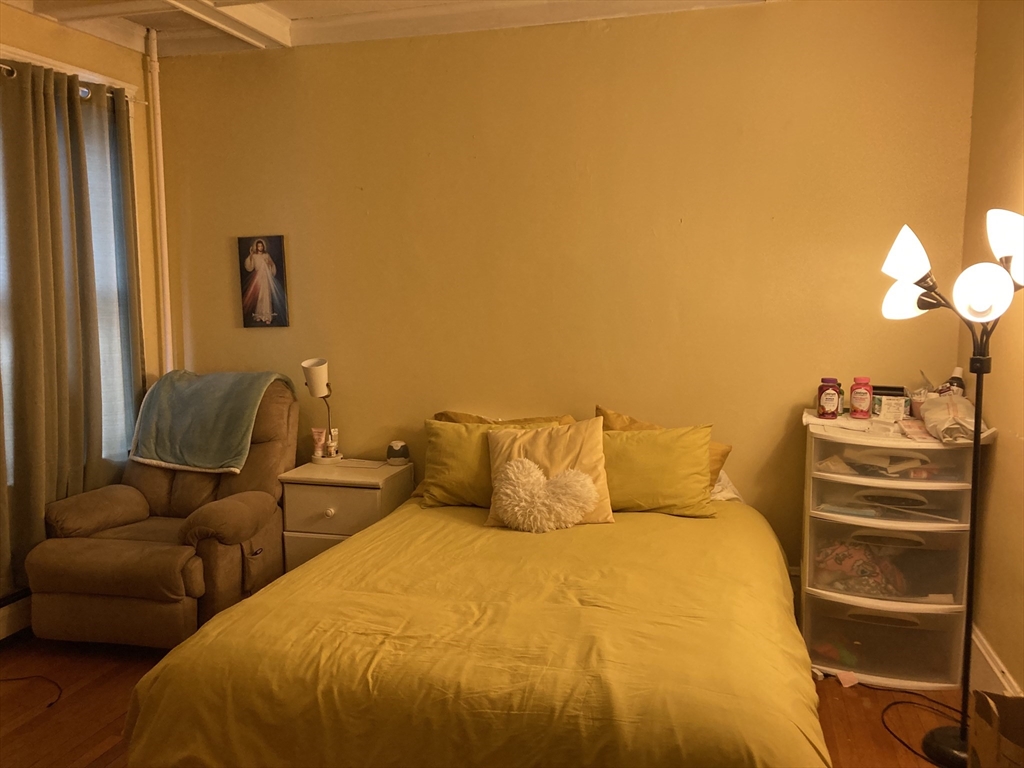 1734 Commonwealth Avenue, Unit 4 Boston, MA 02135 - Photo 6 of 15 a bed room with a bed and furniture