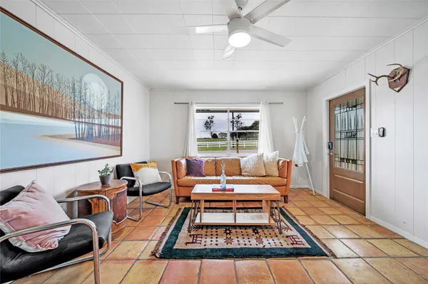 a living room with furniture and a rug