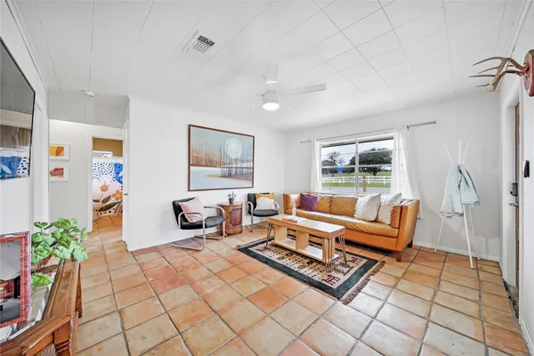 a living room with furniture and a window