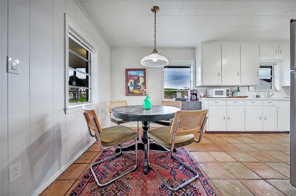 a kitchen with cabinets and stainless steel appliances