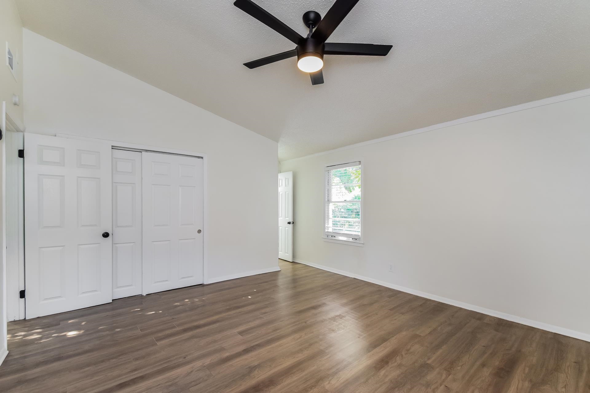 2966 Knight Road Memphis, TN 38118 - Photo 11 of 19 a view of an empty room with window and wooden floor