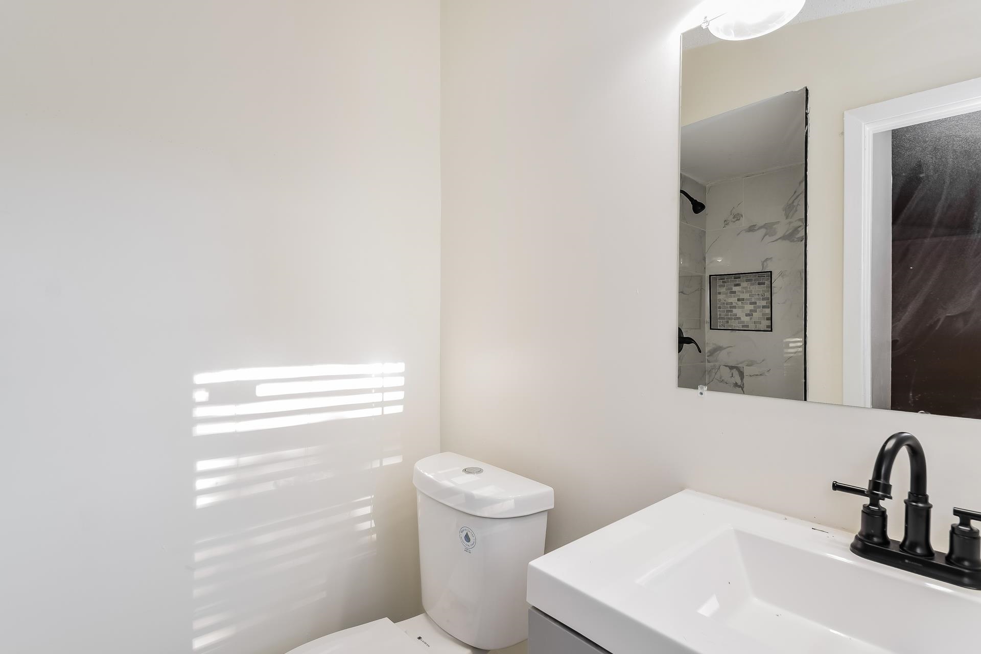 2966 Knight Road Memphis, TN 38118 - Photo 12 of 19 a bathroom with a sink a toilet and shower
