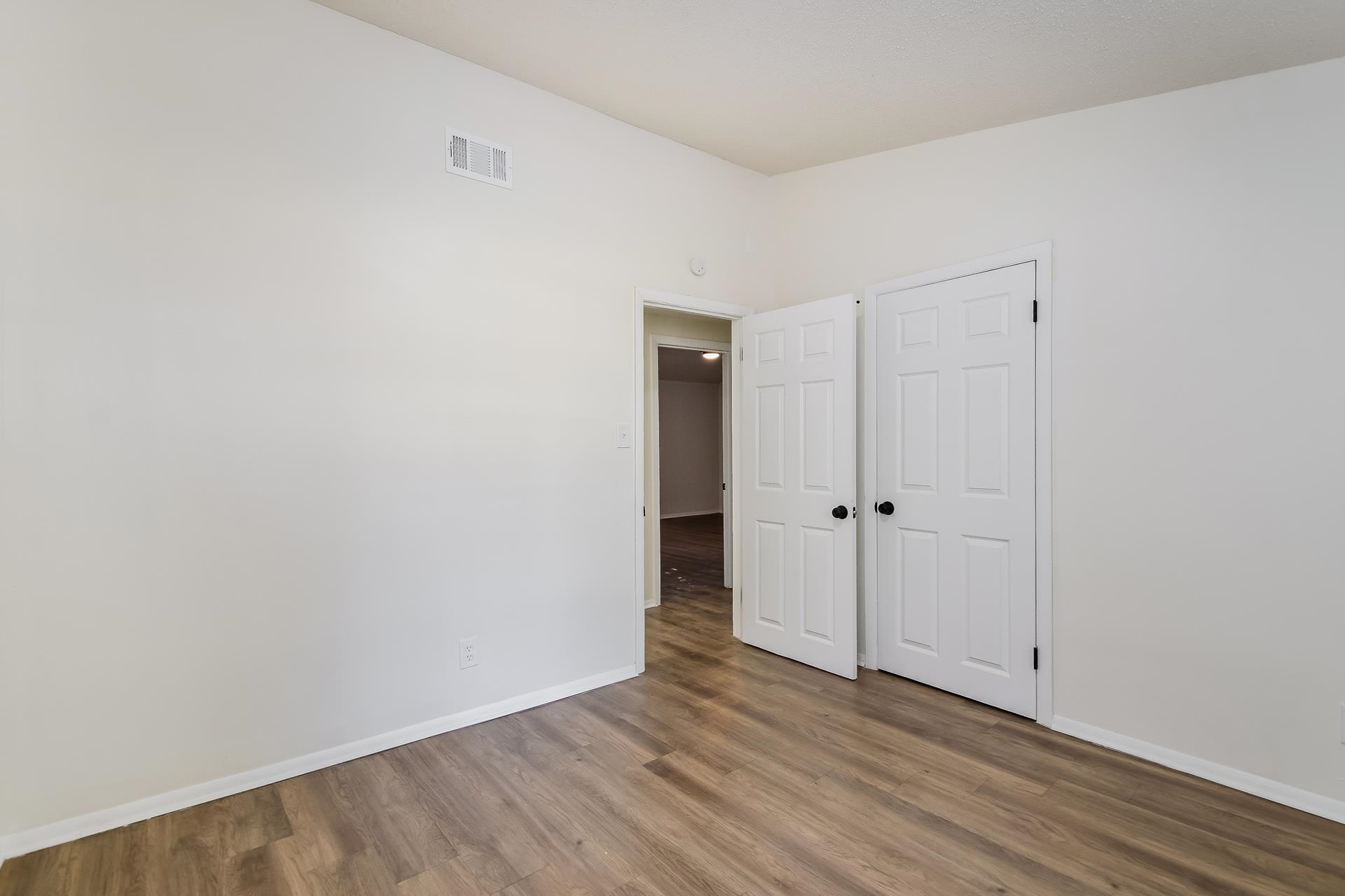 2966 Knight Road Memphis, TN 38118 - Photo 15 of 19 a view of an empty room with wooden floor
