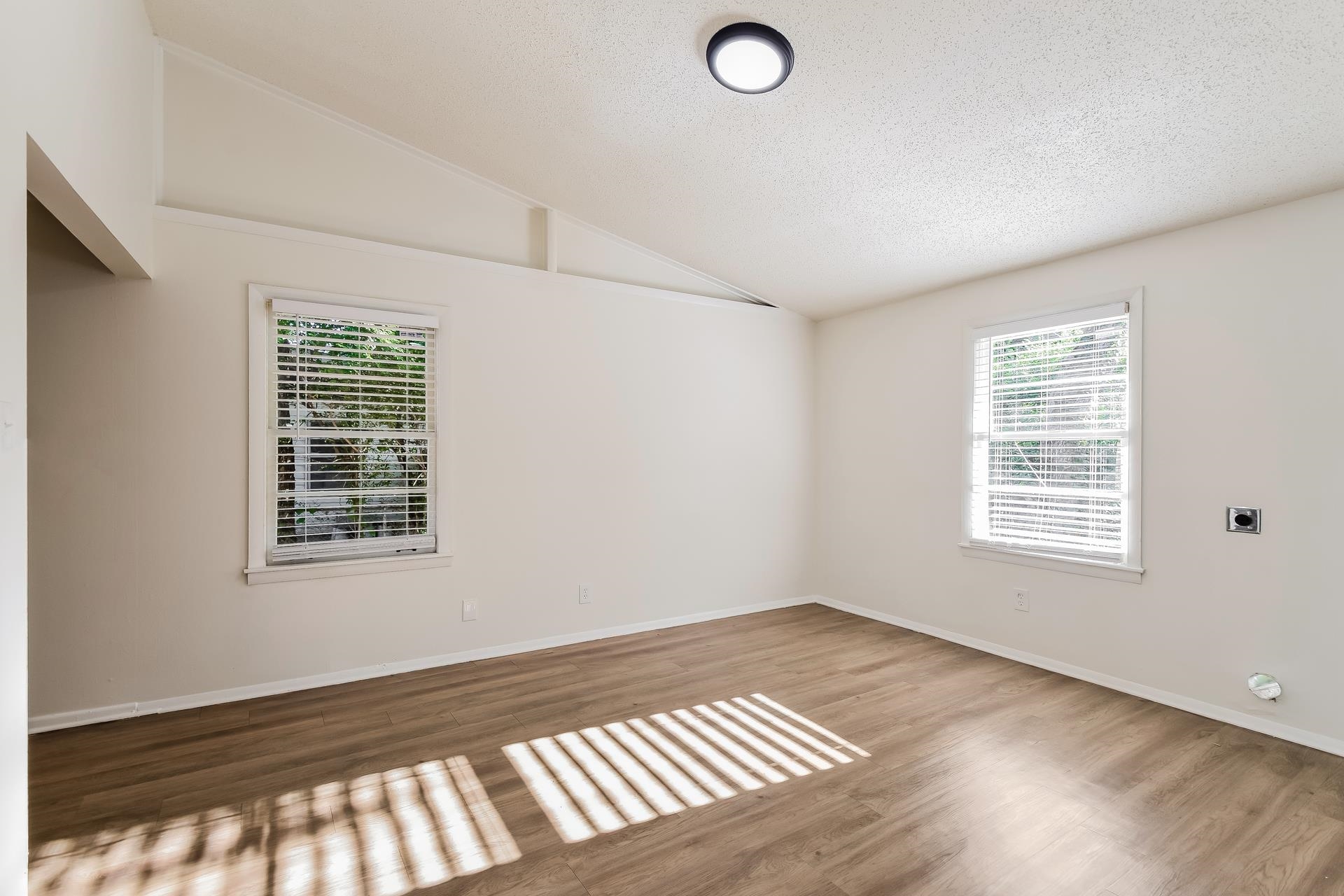 2966 Knight Road Memphis, TN 38118 - Photo 17 of 19 a view of an empty room with wooden floor and a window