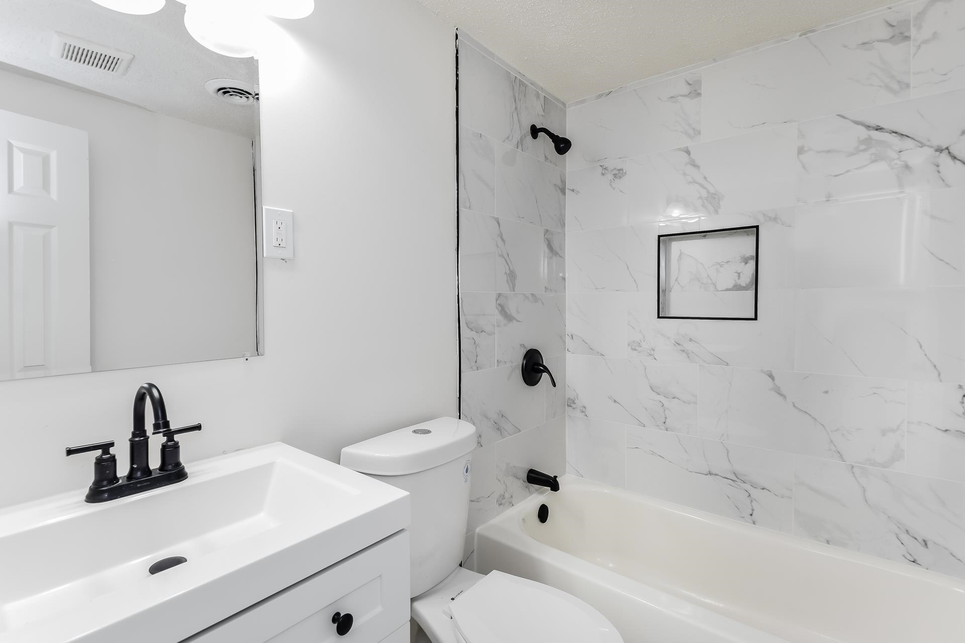 2966 Knight Road Memphis, TN 38118 - Photo 18 of 19 a bathroom with a sink toilet and shower