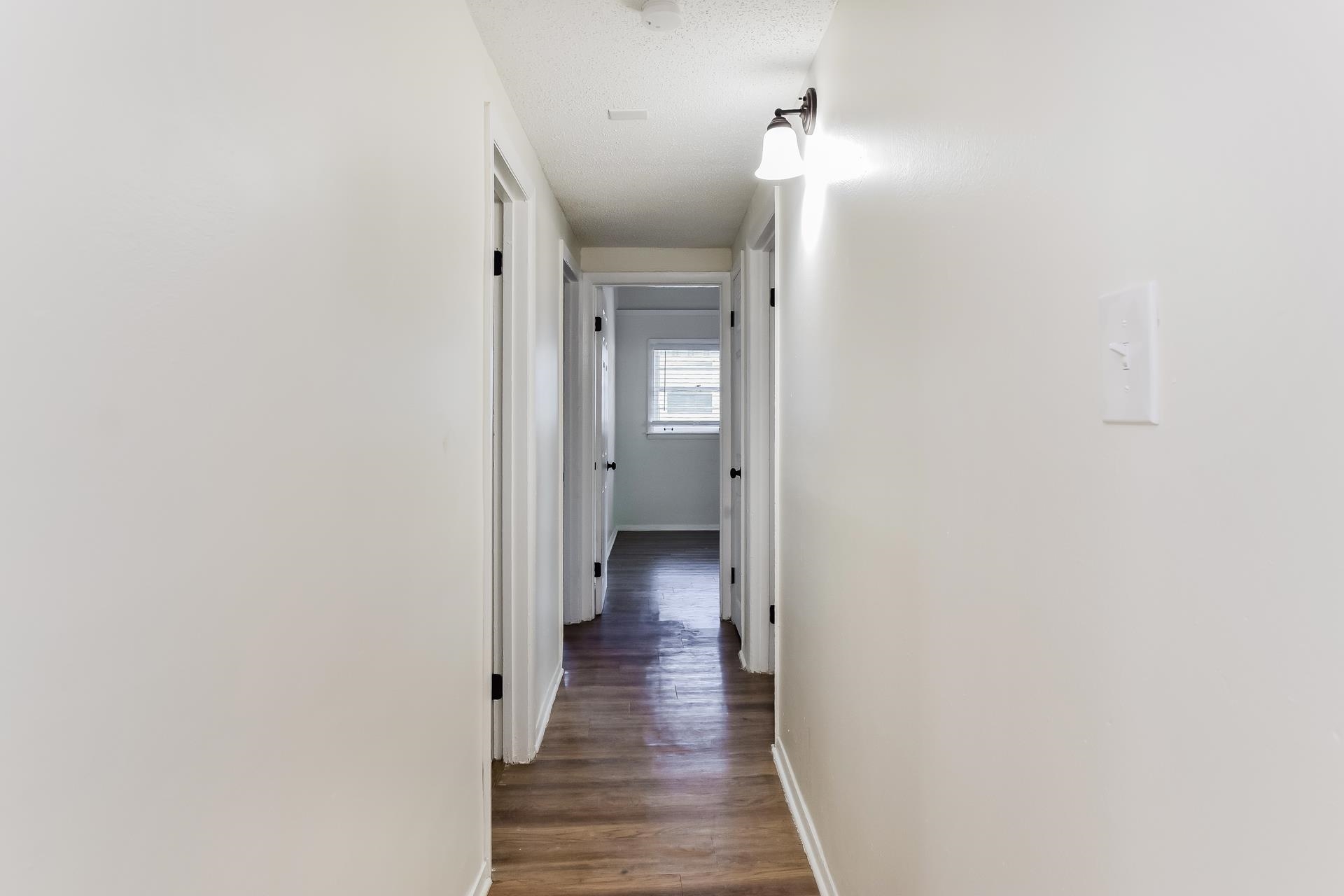 2966 Knight Road Memphis, TN 38118 - Photo 19 of 19 a view of a hallway with wooden floor and closet