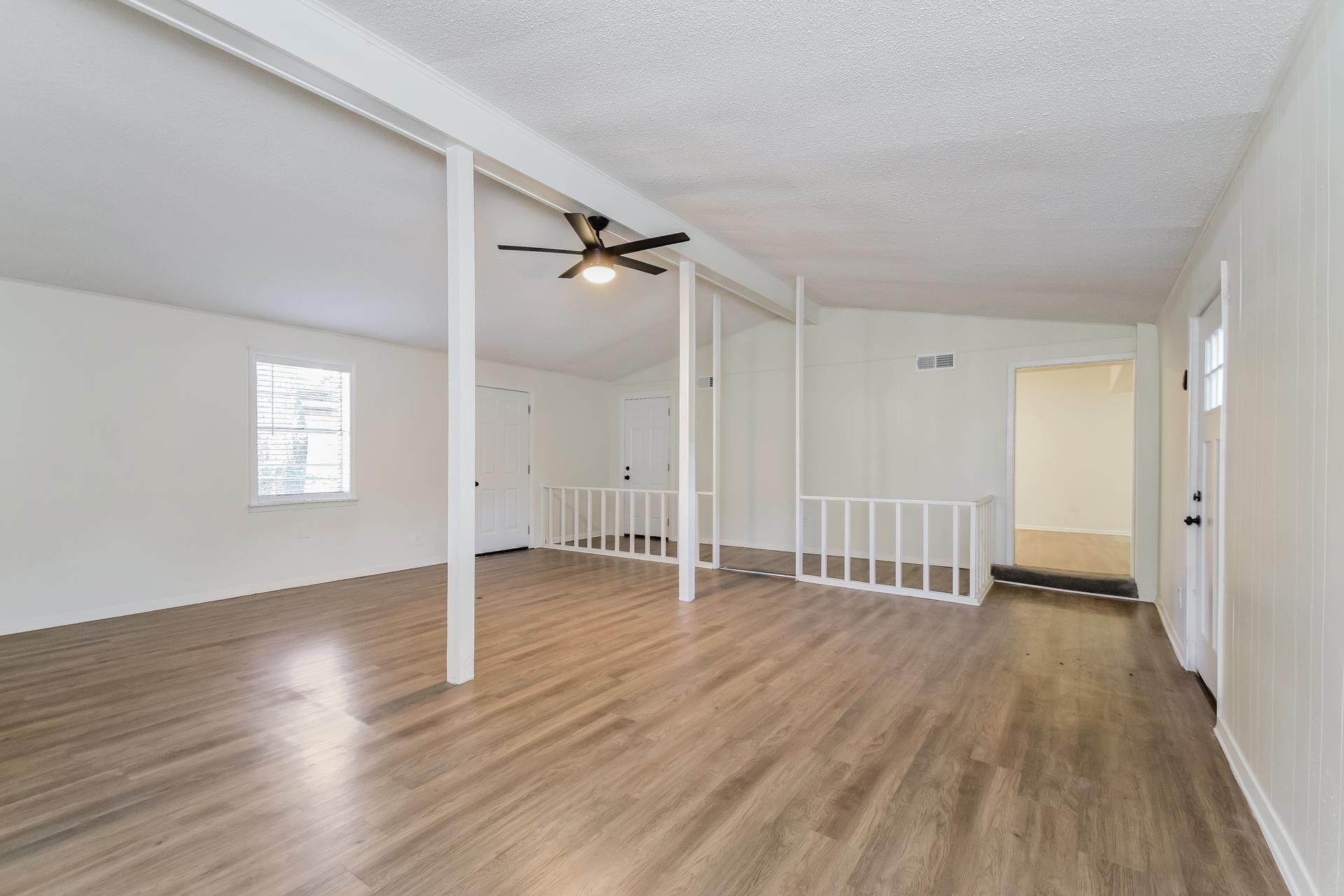 2966 Knight Road Memphis, TN 38118 - Photo 5 of 19 wooden floor in an empty room with a window