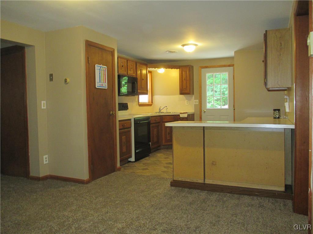 1111 Silver Maple Road West Effort, PA 18330 - Photo 8 of 31 a view of a kitchen with a sink and a refrigerator
