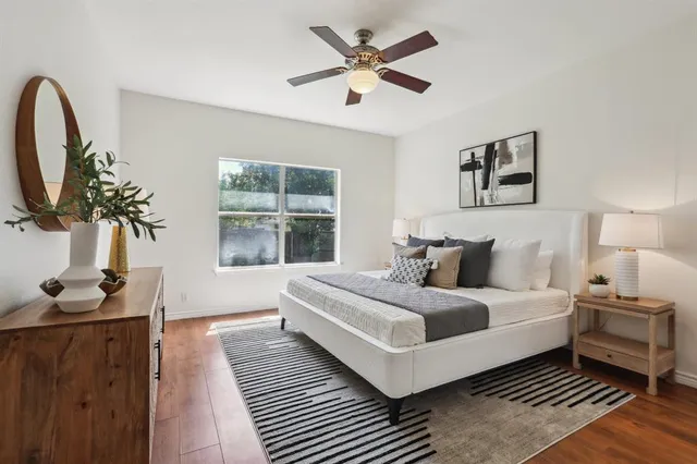 a bedroom with bed and a window