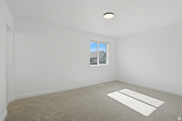 11531 Engelmann Drive Draper, UT 84020 - Photo 26 of 31 Carpeted room featuring a single window with white trim, a flush-mount ceiling light, and white baseboards