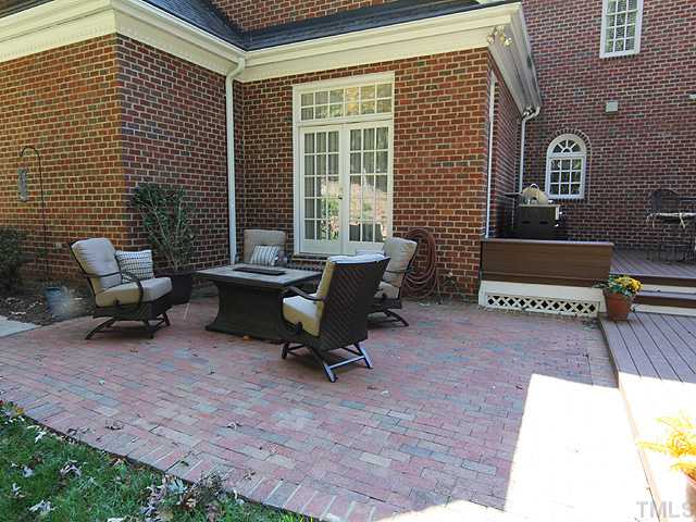 11216 Brass Kettle Road Raleigh, NC 27614 - Photo 22 of 25 a building outdoor space with patio furniture and potted plants