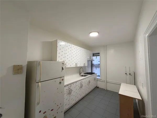 a kitchen with a refrigerator a sink and dishwasher