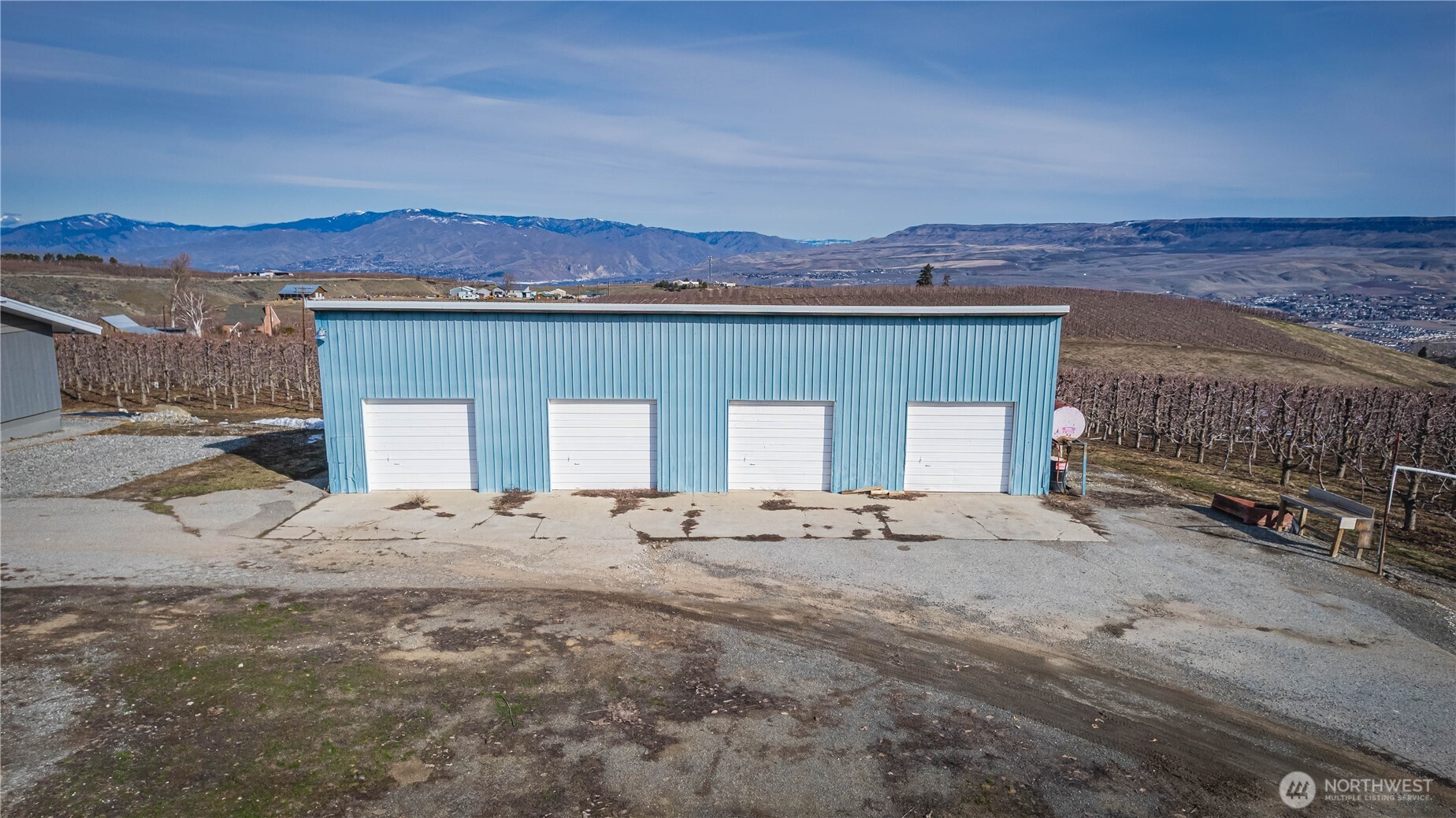 2-b 12 Gudmundson Road Wenatchee, WA 98801 - Photo 1 of 11 a front view of a house with a yard and mountain view