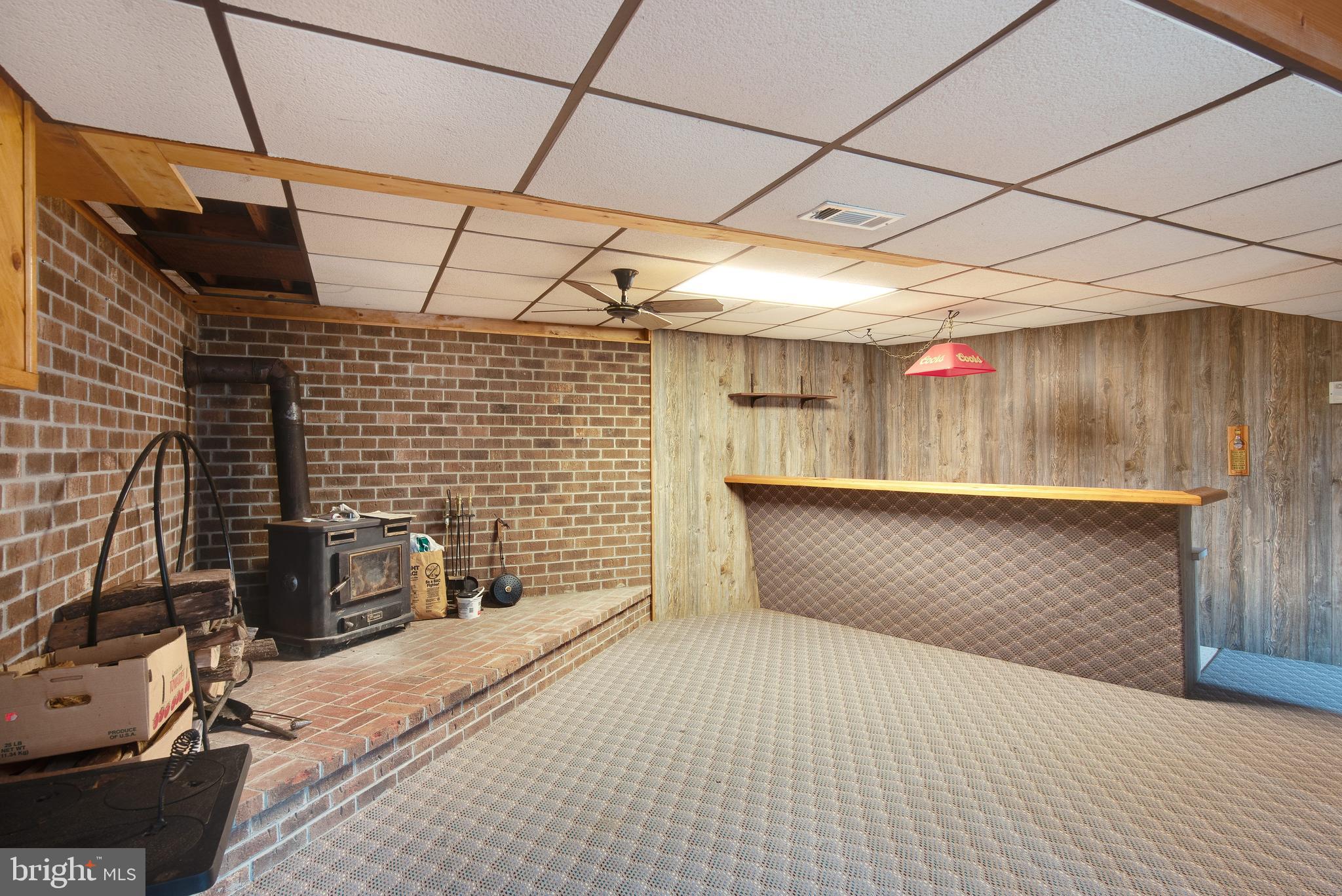 340 Witmer Road Mohnton, PA 19540 - Photo 27 of 35 Family room with wood burning stove and bar