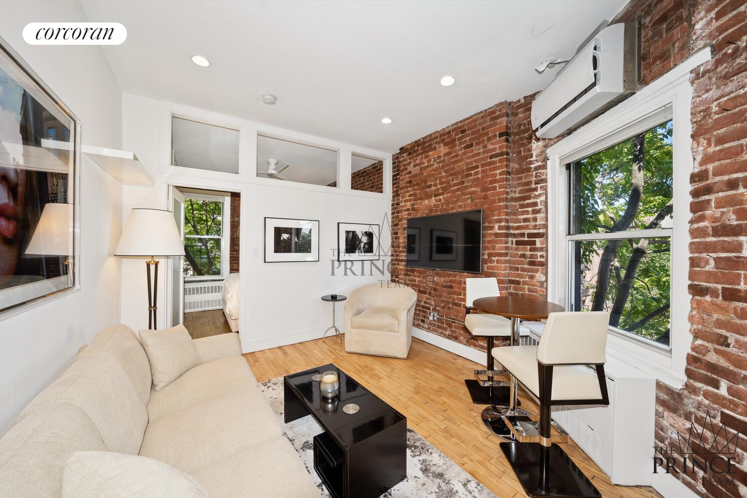 a living room with furniture fireplace and flat screen tv