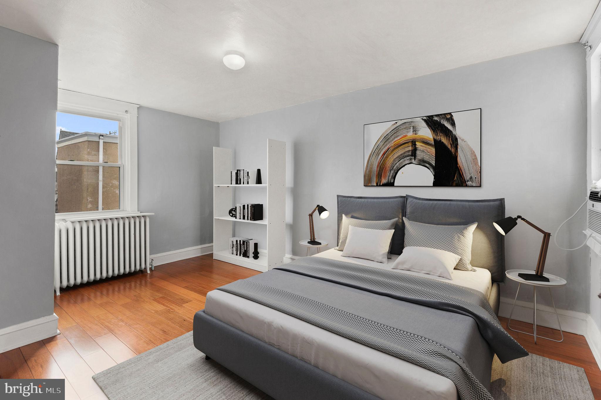 227 Shirley Road Upper Darby, PA 19082 - Photo 19 of 25 a bedroom with a bed and a window