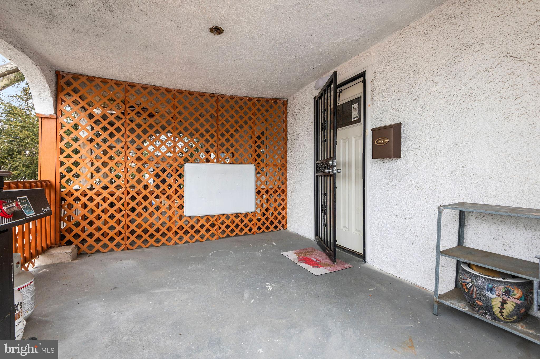 227 Shirley Road Upper Darby, PA 19082 - Photo 3 of 25 a view of a door and wooden fence