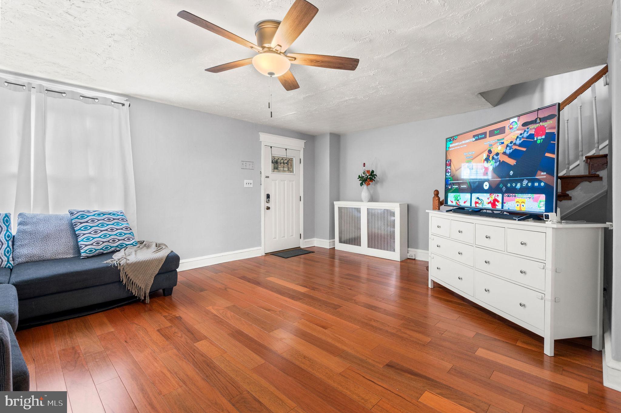 227 Shirley Road Upper Darby, PA 19082 - Photo 8 of 25 a living room with furniture and a flat screen tv