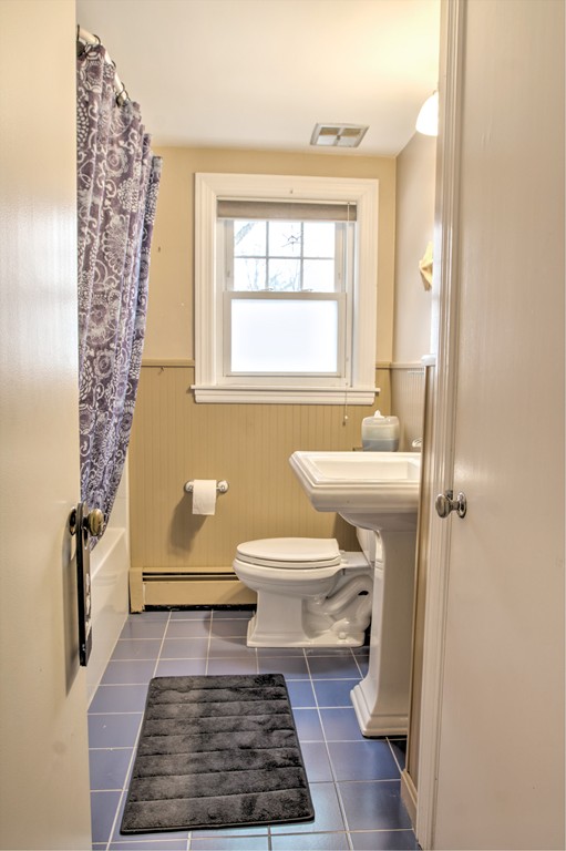 24 Hall Road Chelmsford, MA 01824 - Photo 11 of 30 a bathroom with a toilet a window and a rug