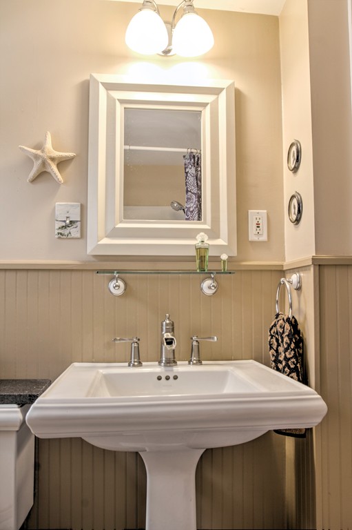 24 Hall Road Chelmsford, MA 01824 - Photo 12 of 30 a bathroom with a sink a mirror and vanity