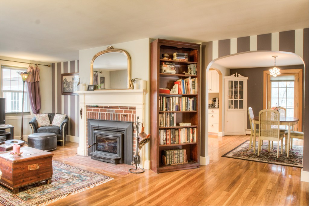 24 Hall Road Chelmsford, MA 01824 - Photo 17 of 30 a living room with furniture a fireplace and a flat screen tv