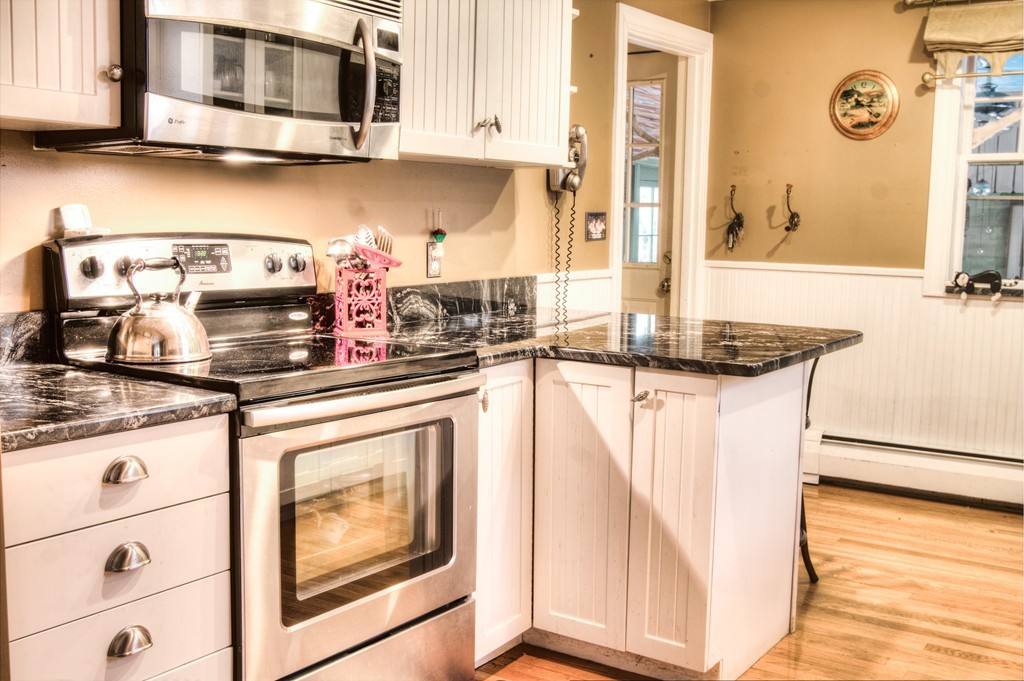 24 Hall Road Chelmsford, MA 01824 - Photo 20 of 30 a kitchen with stainless steel appliances granite countertop a sink and a microwave