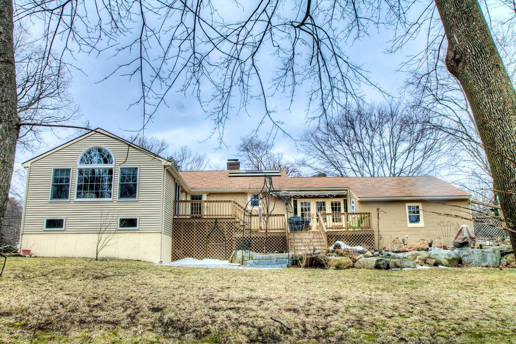 24 Hall Road Chelmsford, MA 01824 - Photo 2 of 30 a front view of a house with a yard