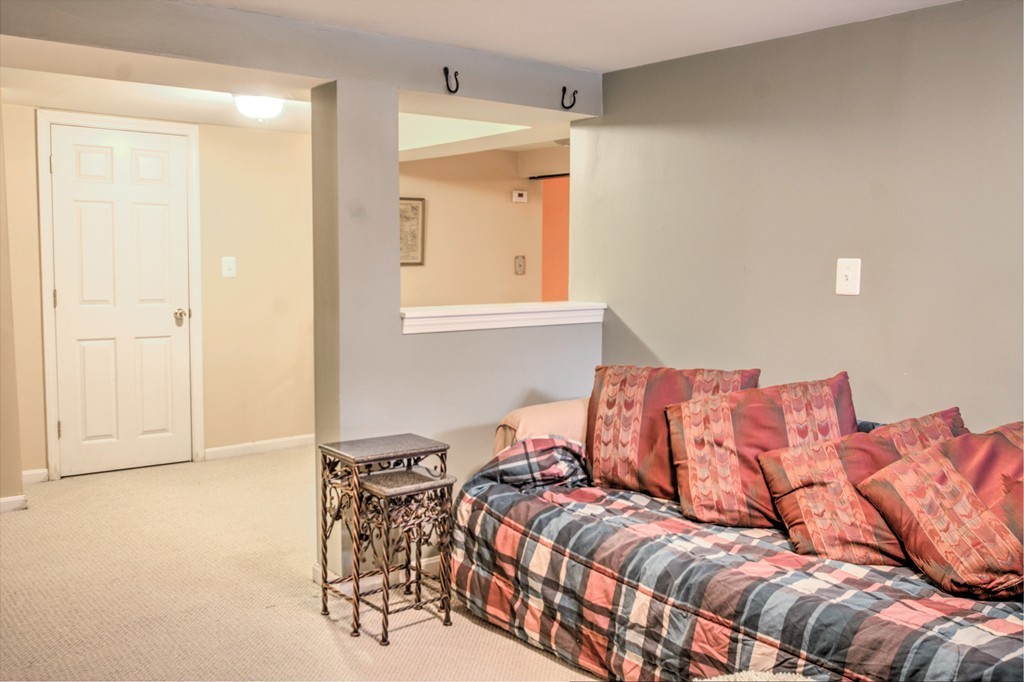 24 Hall Road Chelmsford, MA 01824 - Photo 23 of 30 a living room with a couch and a window