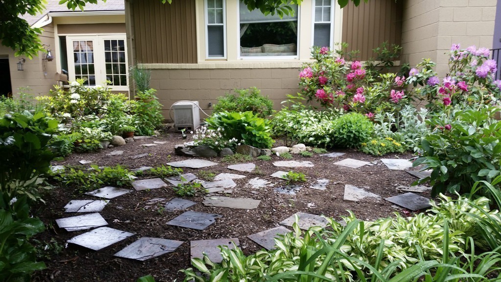 24 Hall Road Chelmsford, MA 01824 - Photo 27 of 30 a view of a backyard with potted plants